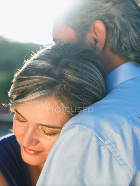 Mature man embracing mature woman — Stock Photo
