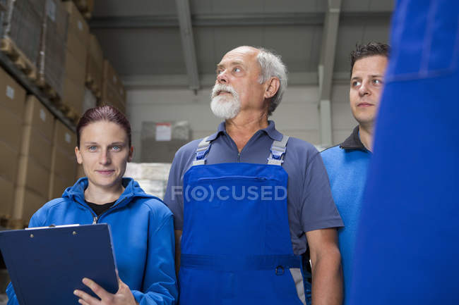 Portrait of team of factory workers — Stock Photo