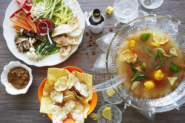 Still life of punch cocktail bowl with party food — Stock Photo