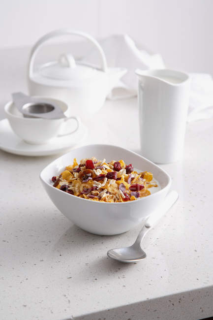 Bowl of granola on breakfast table — Stock Photo