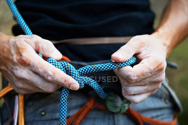 Cropped image of man Climber with rope — Stock Photo