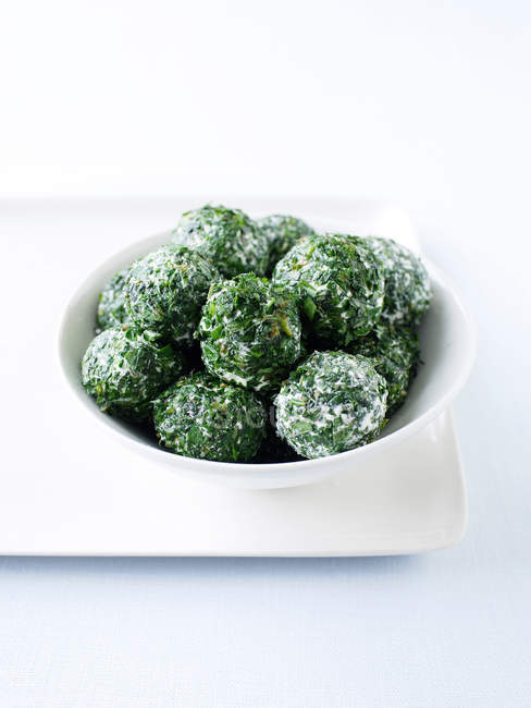 Labna balls rolled with herbs in bowl — Stock Photo