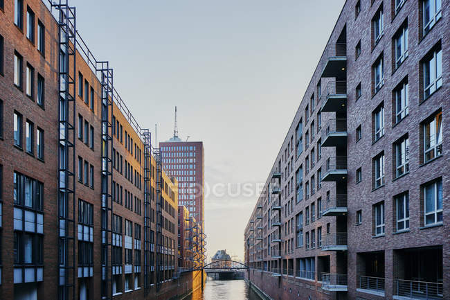 Water channel between rows of apartment buildings — Stock Photo
