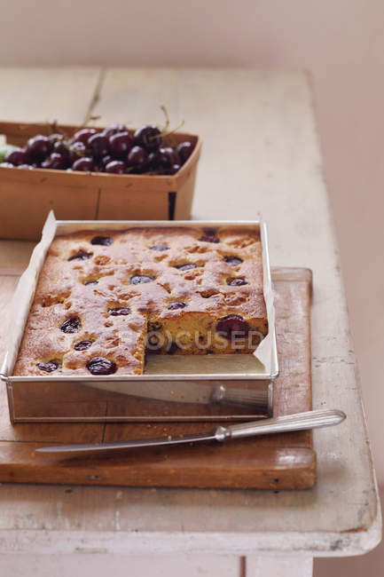 Cherry Blondie pie with slice out — Stock Photo