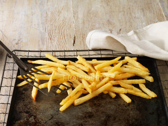 French fries on sheet — Stock Photo