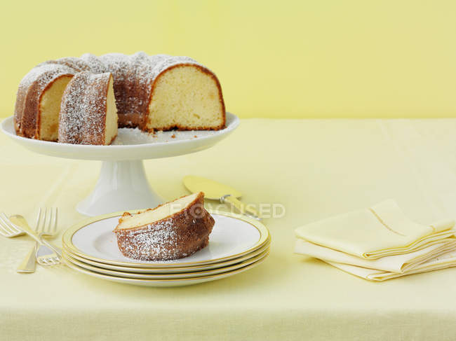 Plates of lemon cake with sugar — Stock Photo