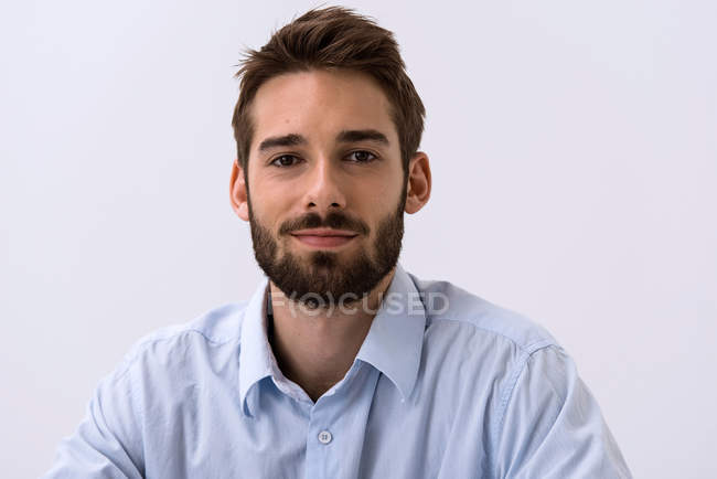 Close up portrait of young man in blue shirt — Stock Photo
