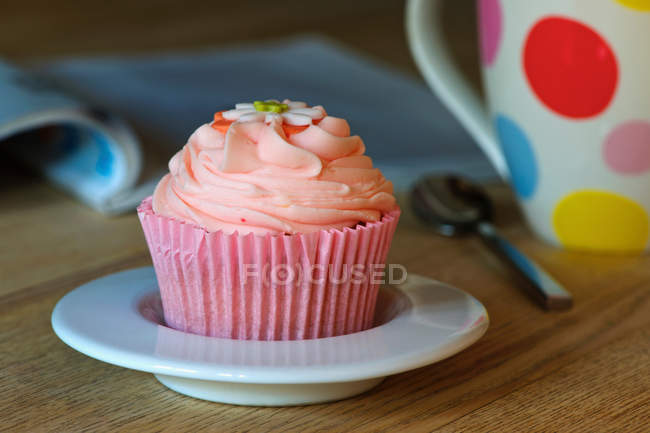 Cupcake decorated with cream — Stock Photo
