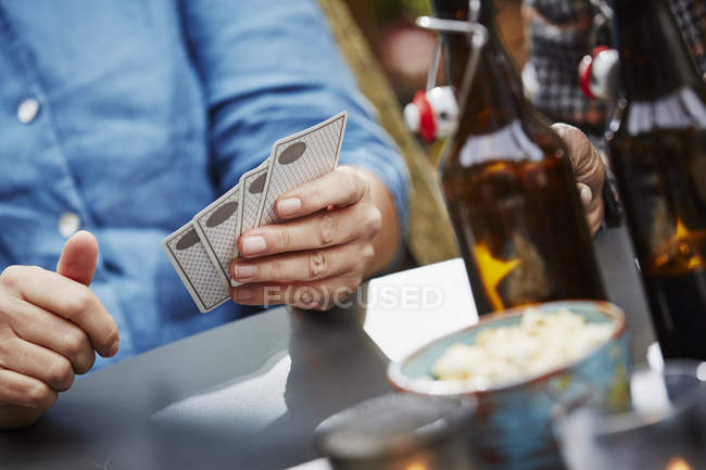 Person holding playing cards, close up — Stock Photo