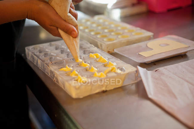 Cropped image of Woman preparing praline dough — Stock Photo