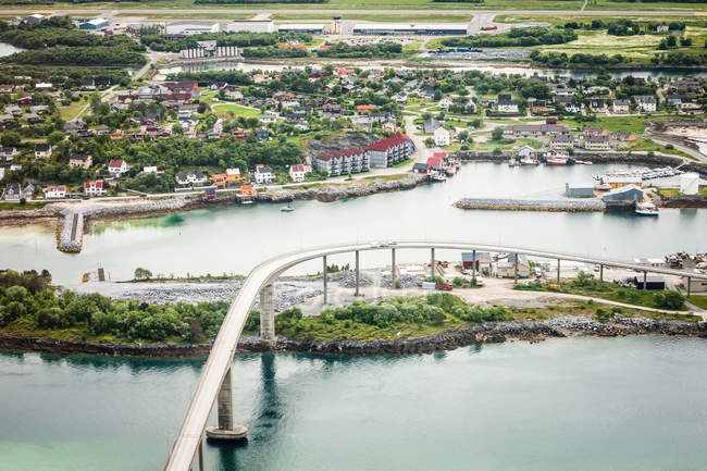 Aerial view of Bridge spanning islands and village — Stock Photo