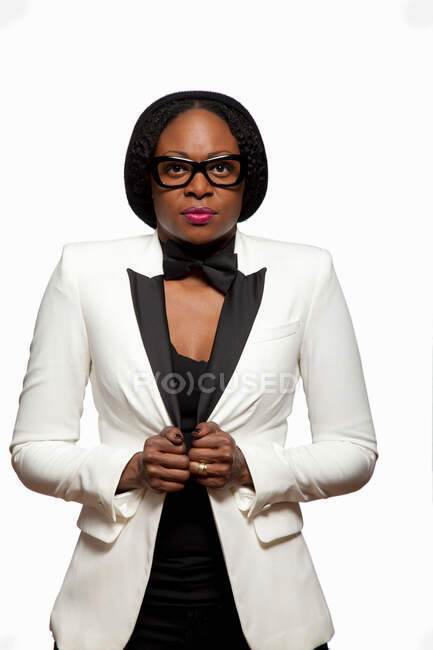 Portrait of woman wearing white jacket and glasses — Stock Photo