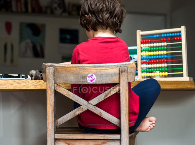 Boy doing his homework at home — Stock Photo