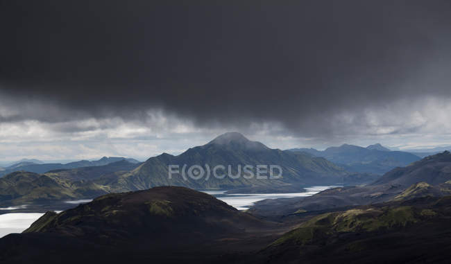 Clouds looming over landscape — Stock Photo