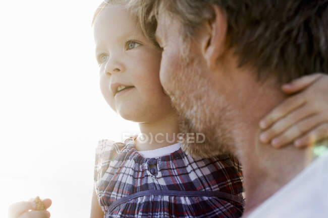 Close up of female toddler and father face to face — Stock Photo