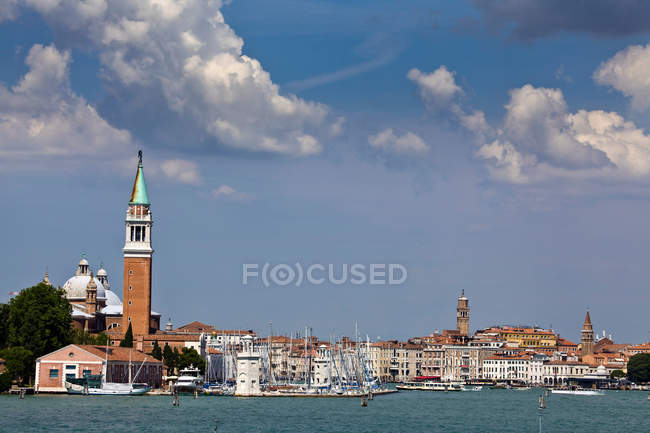Distant view of Church steeple and city skyline — Stock Photo