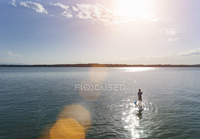 Boy paddling in Lake Starnberg, Bavaria, Germany — Stock Photo