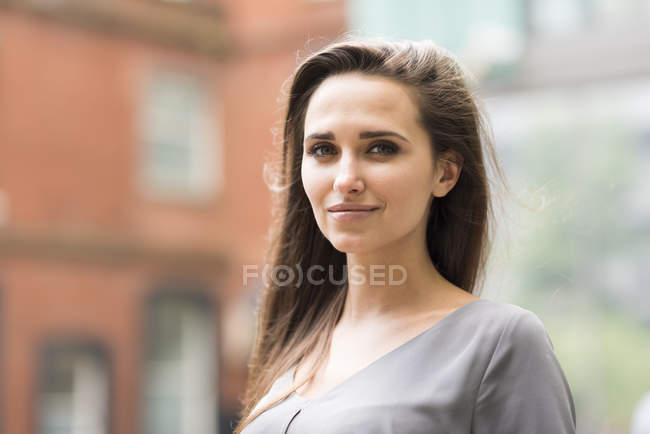 Portrait of young businesswoman on city street, London, UK — Stock Photo