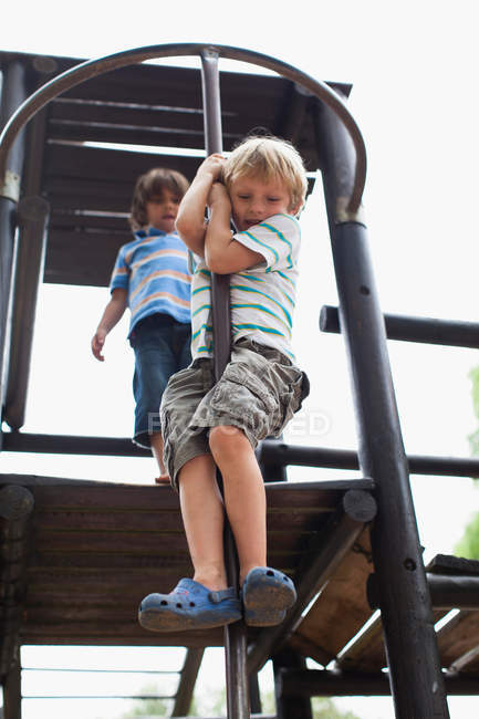 Boys playing on play structure together — Stock Photo