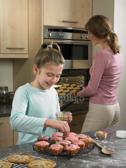 Mother and daughter baking together, selective focus — Stock Photo