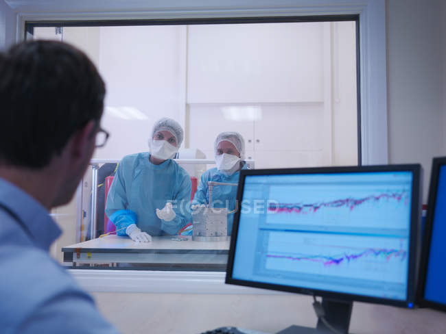 Workers In Clean Room Computer Monitor Front View Stock