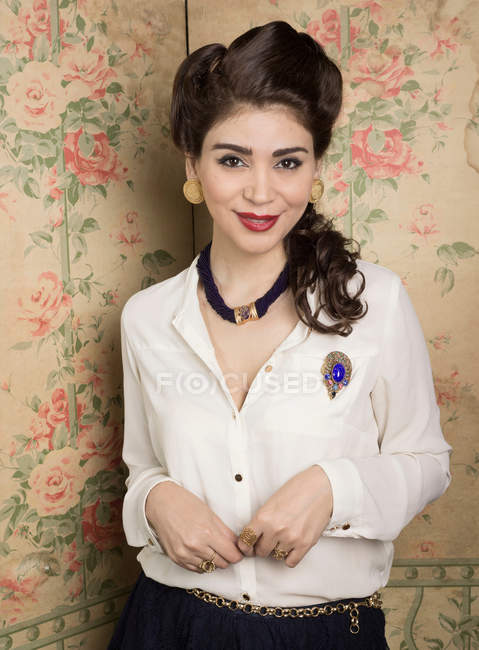 Woman in vintage clothes standing in corner — Stock Photo
