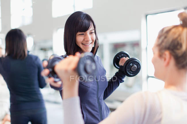 Trainer working with client in gym — Stock Photo