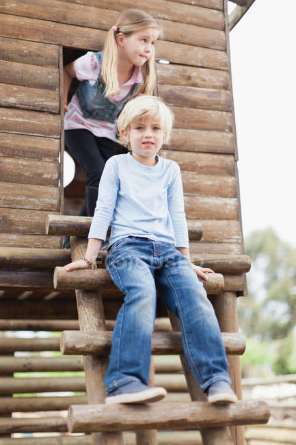 Children climbing out of playhouse, selective focus — Stock Photo