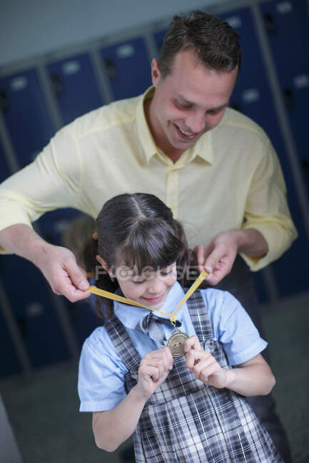 School girl being awarded medal — Stock Photo