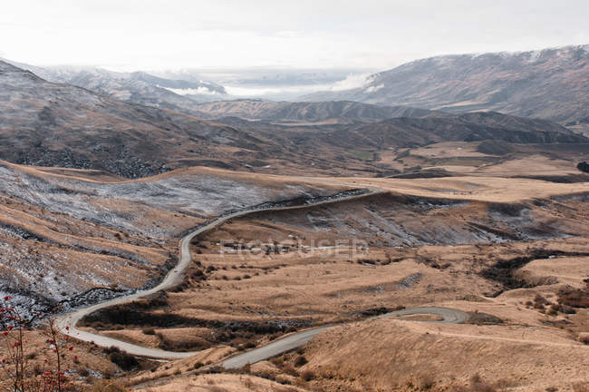 Curved road in rural landscape — Stock Photo