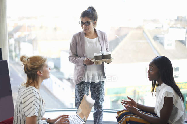 Three businesswomen having discussion — Stock Photo