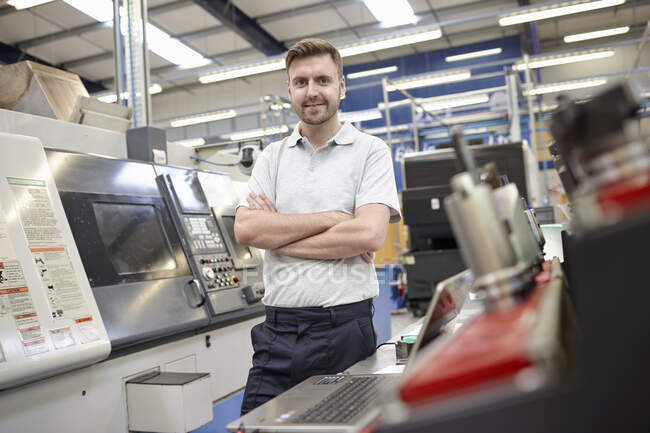 Portrait of male worker in engineering factory — Stock Photo