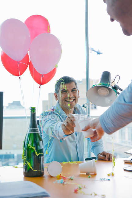 Businessmen toasting at office party, selective focus — Stock Photo