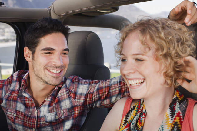 Couple riding in jeep together — Stock Photo