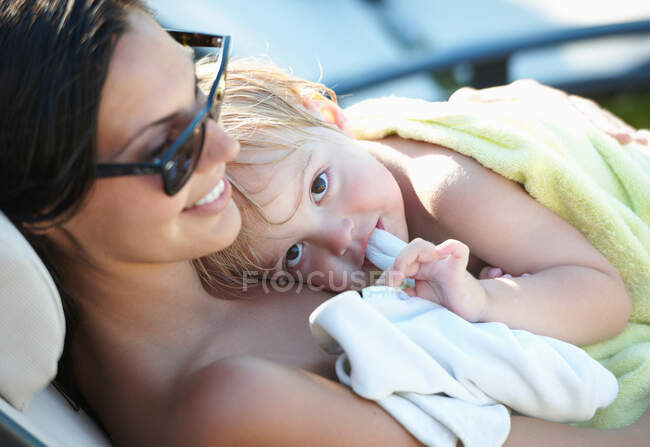 Mother and baby boy resting after pool — Stock Photo