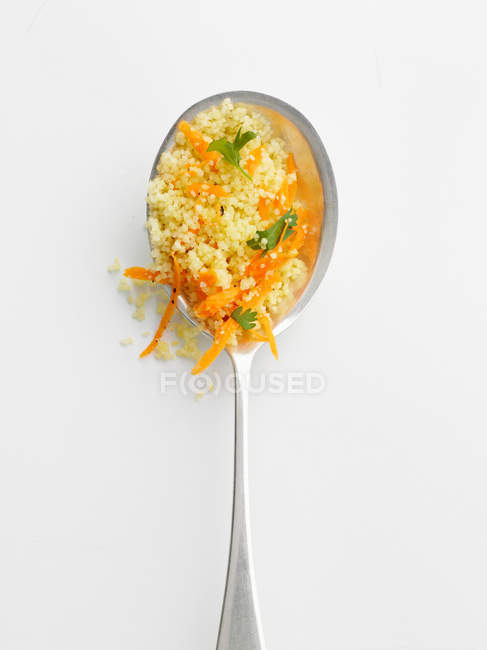 Spoonful of couscous and herbs, close up shot — Stock Photo