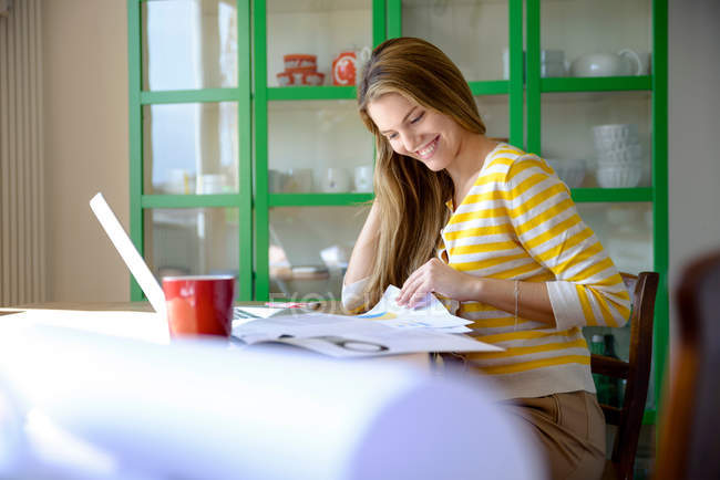 Young woman working from home — Stock Photo