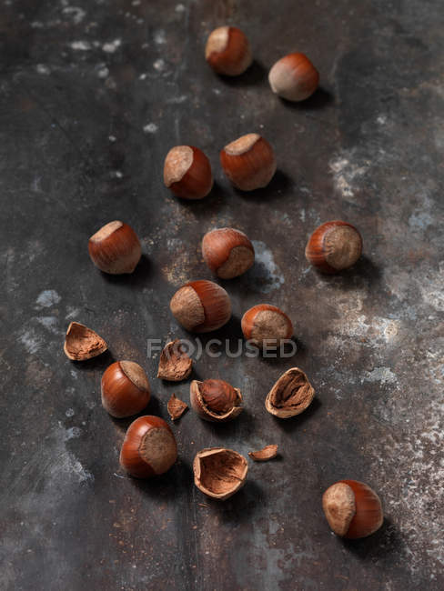 Hazelnuts on wooden board — Stock Photo