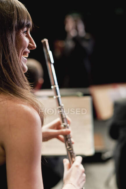 Flute player in orchestra — Stock Photo