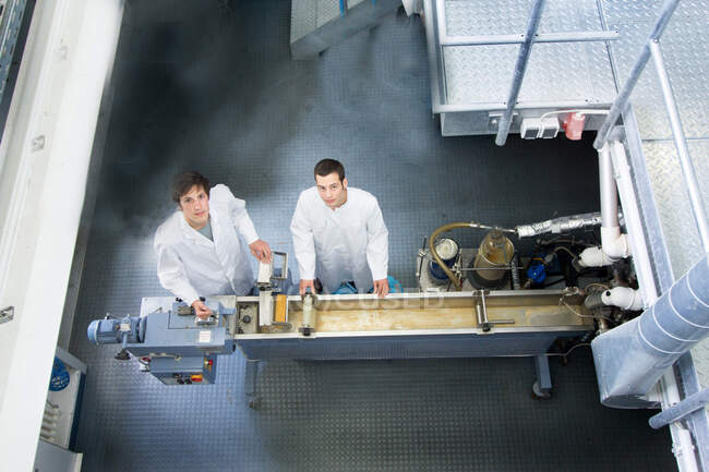 Elevated view of two technicians in working laboratory — Stock Photo