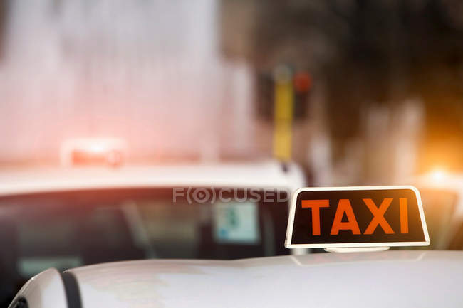 Taxi sign on cab roof — Stock Photo