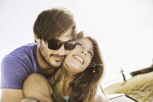 Mid adult couple hugging on coast road, Cape Town, South Africa — Stock Photo