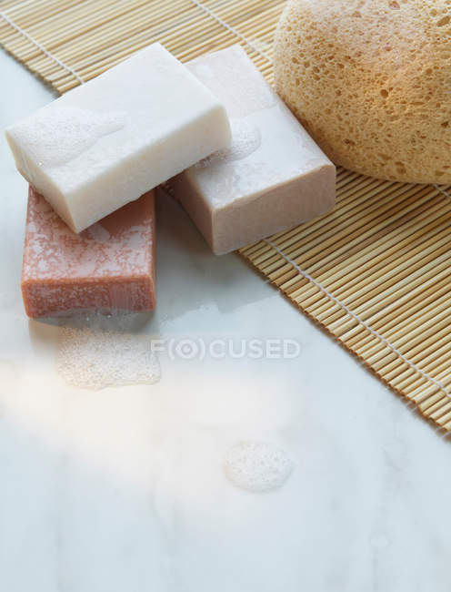 Soap on straw mat — Stock Photo