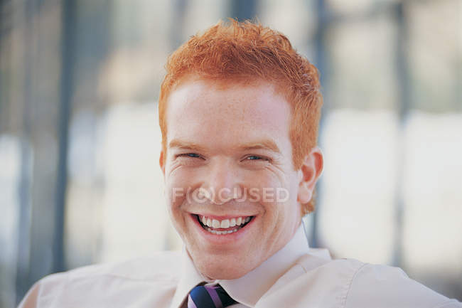 Close up of redheared  businessman laughing — Stock Photo