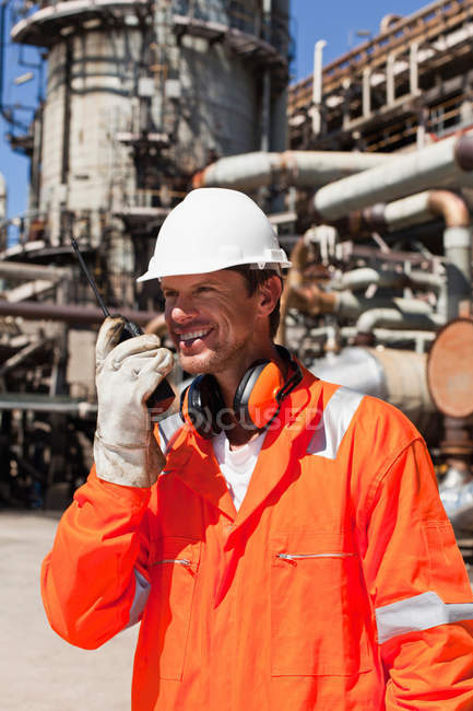 Worker with walkie talkie on site — Stock Photo