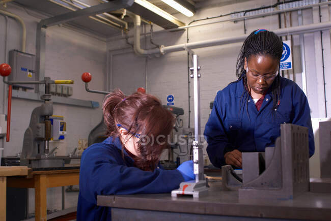 Workers using tools in factory — Stock Photo
