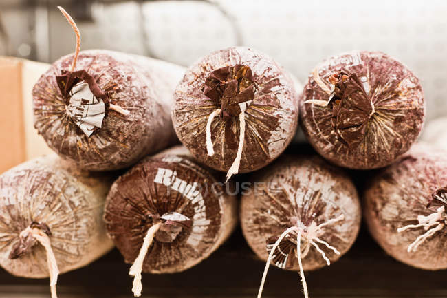 Close up of wrapped cured meat — Stock Photo