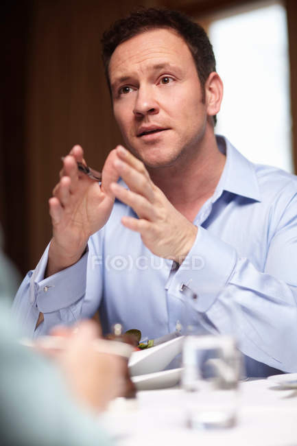 Businessman talking in cafe, selective focus — Stock Photo