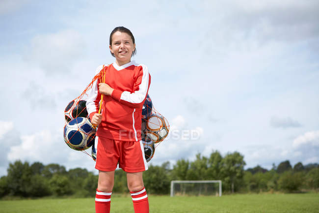 Futebolista com saco de bolas — Fotografia de Stock