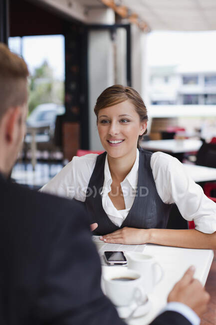 Businesswoman talking at lunch — Stock Photo